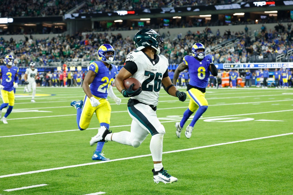 INGLEWOOD, CALIFORNIA - NOVEMBER 24: Saquon Barkley #26 of the Philadelphia Eagles runs for a touchdown during the third quarter against the Los Angeles Rams at SoFi Stadium on November 24, 2024 in Inglewood, California.