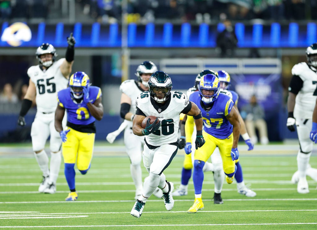 INGLEWOOD, CALIFORNIA - NOVEMBER 24: Saquon Barkley #26 of the Philadelphia Eagles runs for a touchdown during the third quarter against the Los Angeles Rams at SoFi Stadium on November 24, 2024 in Inglewood, California.