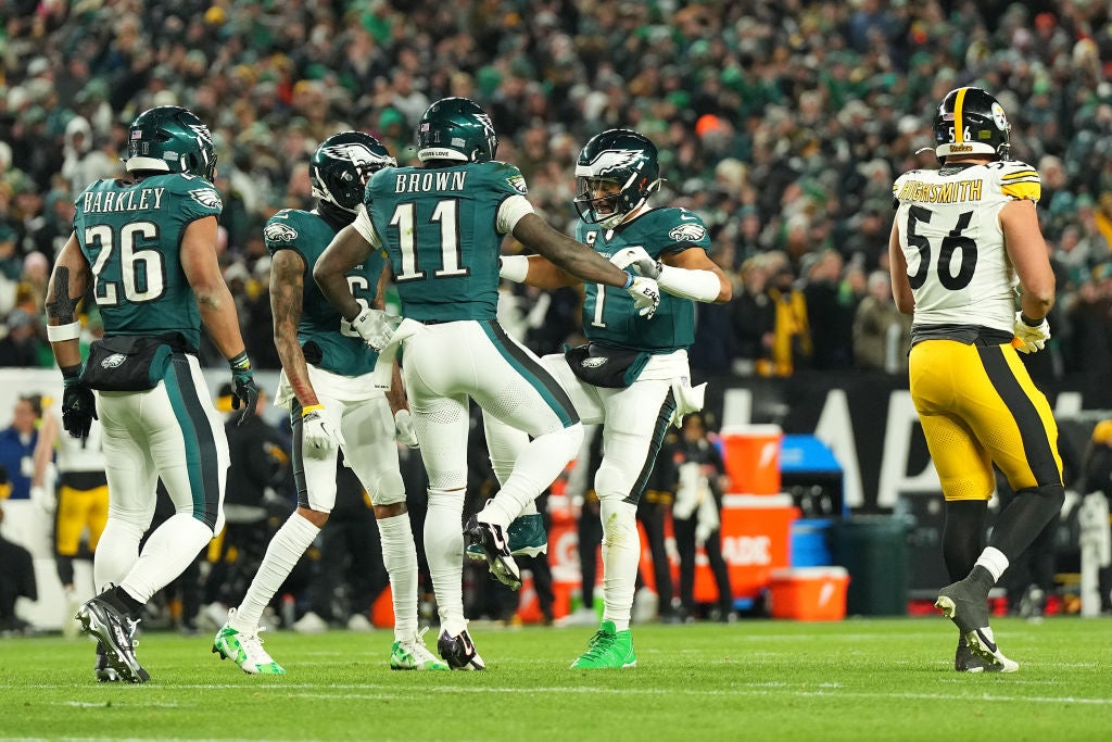 PHILADELPHIA, PENNSYLVANIA - DECEMBER 15: A.J. Brown #11 of the Philadelphia Eagles celebrates with teammate Jalen Hurts #1 after scoring a touchdown against the Pittsburgh Steelers during the first quarter at Lincoln Financial Field on December 15, 2024 in Philadelphia, Pennsylvania.