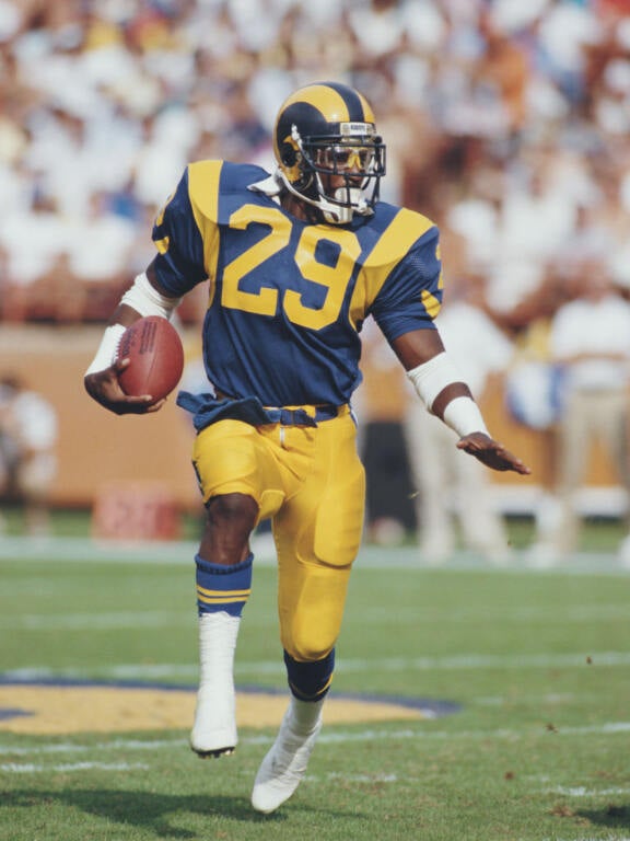 Eric Dickerson #29, Running back for the Los Angeles Rams runs the ball during the National Football Conference West game against the Detroit Lions on 19 October 1986 at the Anaheim Stadium, Anaheim, California, United States. The Rams won the game 14 - 10. 