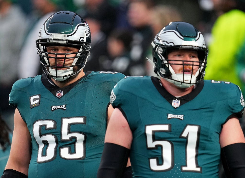 PHILADELPHIA, PENNSYLVANIA - DECEMBER 03: Lane Johnson #65 and Cam Jurgens #51 of the Philadelphia Eagles warms up prior to the game against the San Francisco 49ers at Lincoln Financial Field on December 03, 2023 in Philadelphia, Pennsylvania. 