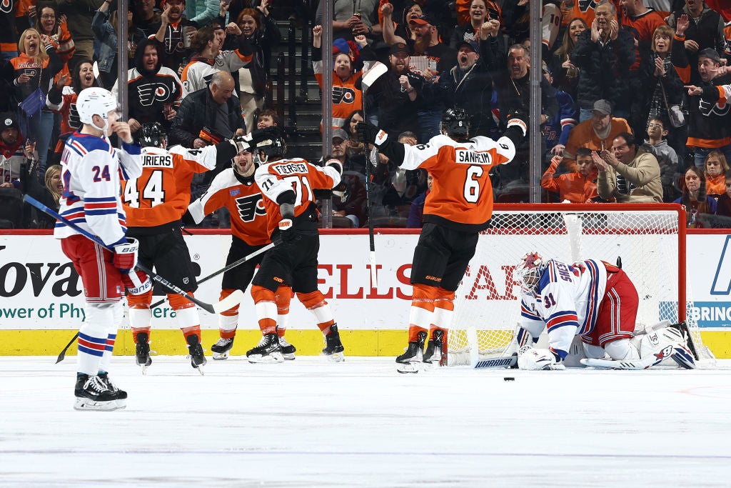 Nicolas Deslauriers #44, Scott Laughton #21, Tyson Foerster #71 and Travis Sanheim #6 of the Philadelphia Flyers react after a goal by Foerster during the third period against the New York Rangers at the Wells Fargo Center on February 24, 2024 in Philadelphia, Pennsylvania.