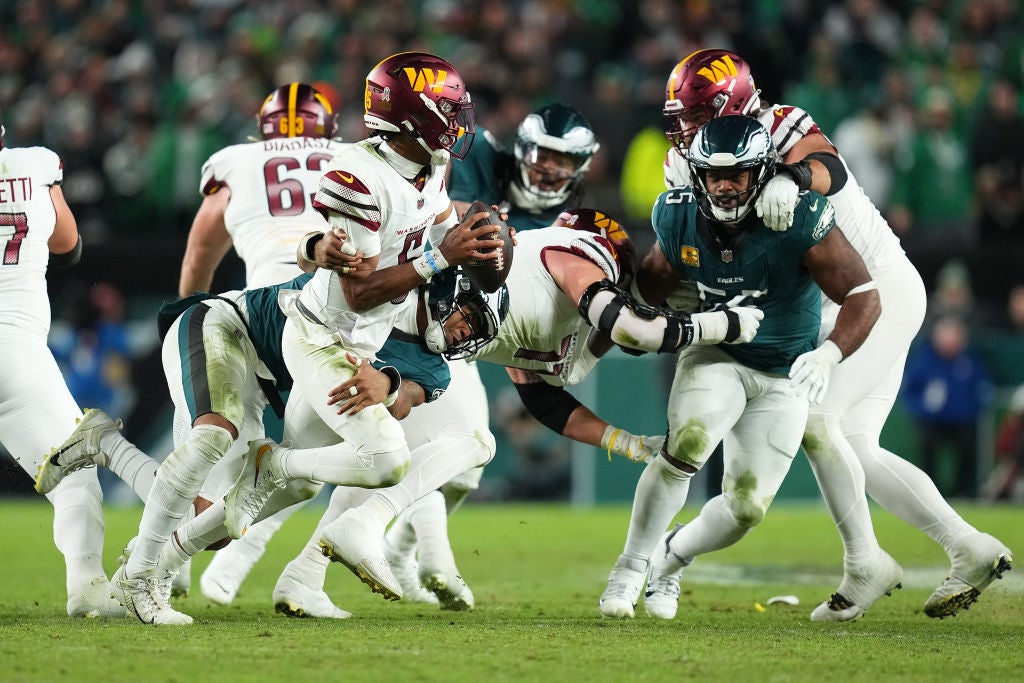 PHILADELPHIA, PENNSYLVANIA - NOVEMBER 14: Nolan Smith Jr. #3 of the Philadelphia Eagles sacks Jayden Daniels #5 of the Washington Commanders during the third quarter at Lincoln Financial Field on November 14, 2024 in Philadelphia, Pennsylvania.