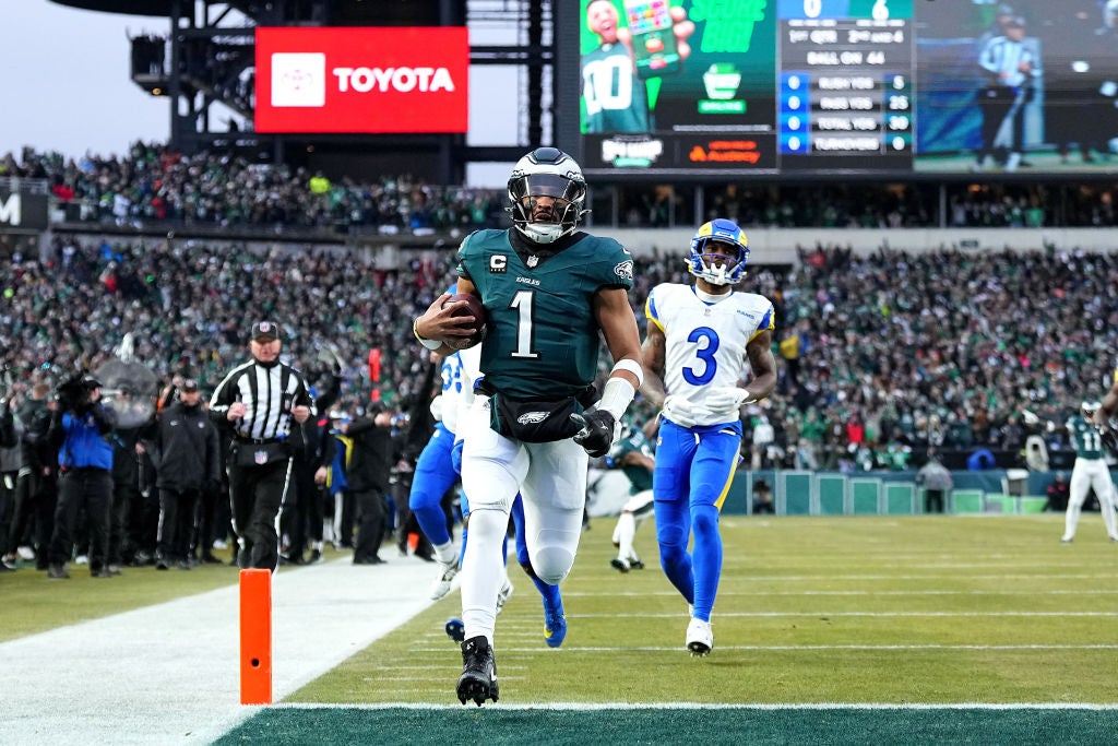 PHILADELPHIA, PENNSYLVANIA - JANUARY 19: Jalen Hurts #1 of the Philadelphia Eagles runs the ball for a 44-yard touchdown against the Los Angeles Rams during the first quarter during the NFC Divisional Playoff at Lincoln Financial Field on January 19, 2025 in Philadelphia, Pennsylvania. 