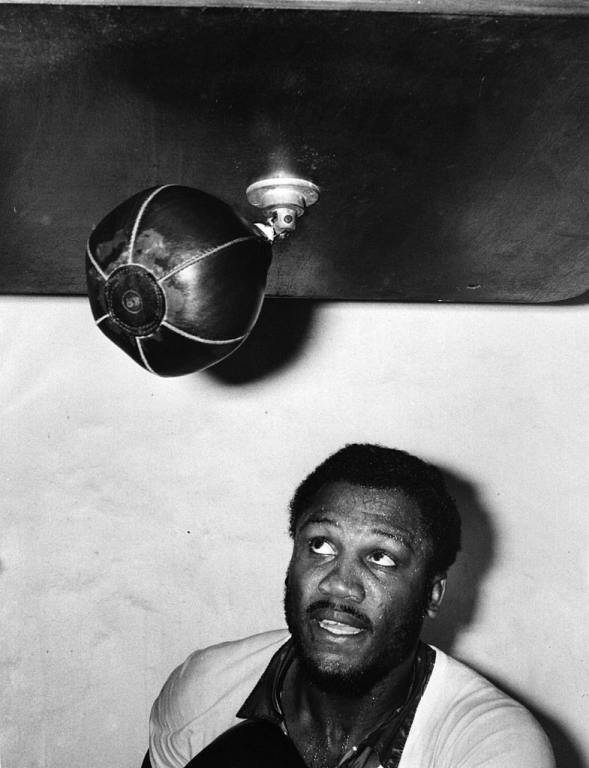 19th June 1976: Boxer Joe Frazier hits the punching bag.