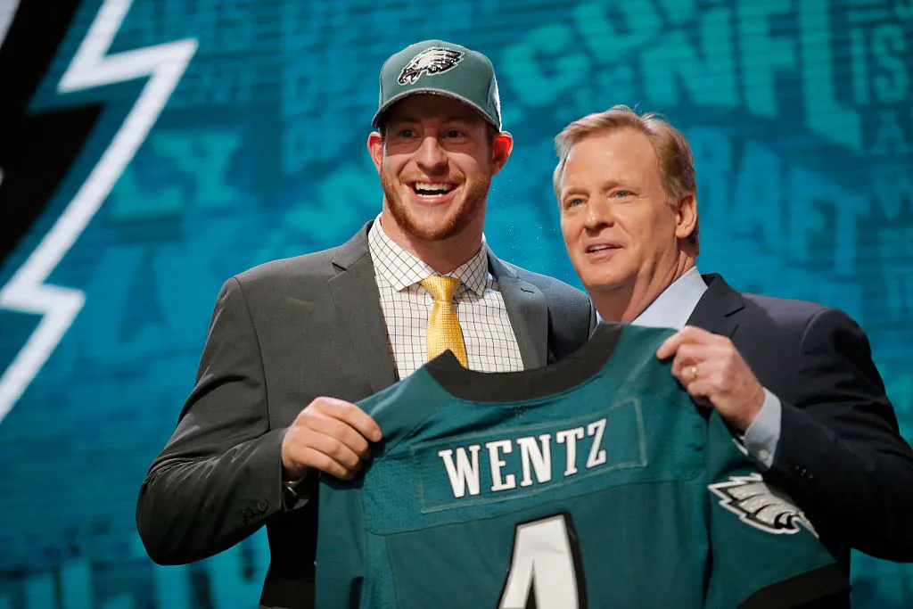 CHICAGO, IL - APRIL 28: (L-R) Carson Wentz of the North Dakota State Bison holds up a jersey with NFL Commissioner Roger Goodell after being picked #2 overall by the Philadelphia Eagles during the first round of the 2016 NFL Draft at the Auditorium Theatre of Roosevelt University on April 28, 2016 in Chicago, Illinois. 