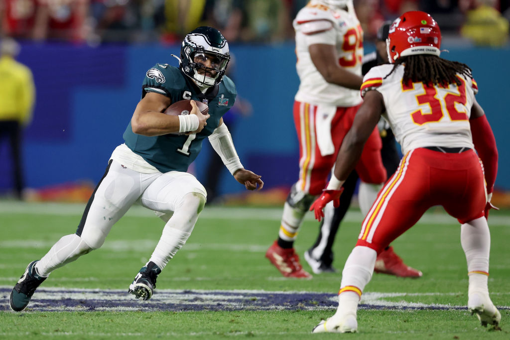 Jalen Hurts #1 of the Philadelphia Eagles runs the ball against Nick Bolton #32 of the Kansas City Chiefs during the fourth quarter in Super Bowl LVII at State Farm Stadium on February 12, 2023 in Glendale, Arizona.