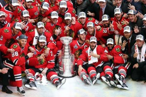 The Chicago Blackhawks pose with the Stanley Cup after defeating the Tampa Bay Lightning by a score of 2-0 in Game Six to win the 2015 NHL Stanley Cup Final at the United Center on June 15, 2015 in Chicago, Illinois.