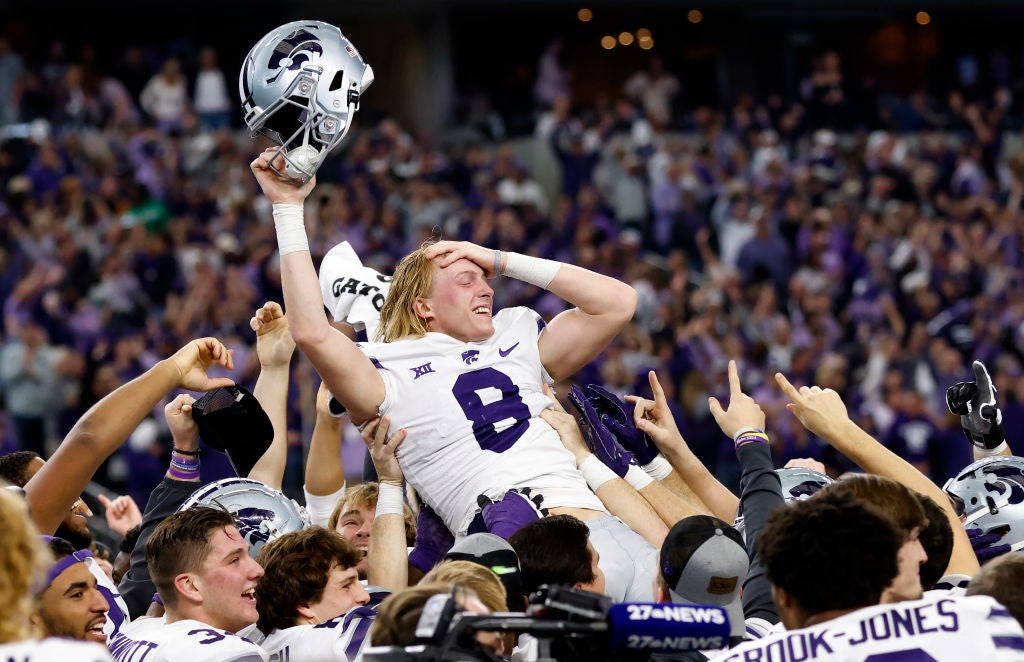 ARLINGTON, TX - DECEMBER 3: Ty Zentner #8 of the Kansas State Wildcats is carried away by teammates after kicking the game winning field goal in overtime against the TCU Horned Frogs in the Big 12 Football Championship at AT&T Stadium on December 3, 2022 in Arlington, Texas. Kansas State won 31-28 in overtime.