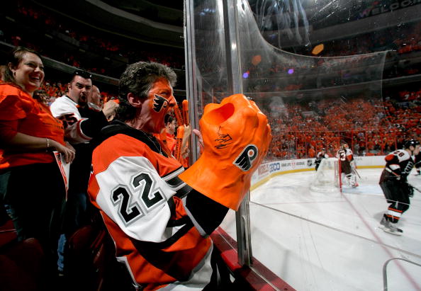 A Philadelphia Flyers fan cheers on his team during warm ups before game three
