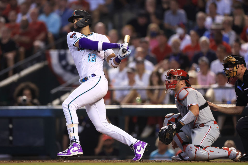 PHOENIX, ARIZONA - OCTOBER 19: Lourdes Gurriel Jr. #12 of the Arizona Diamondbacks hits an RBI double against the Philadelphia Phillies during the seventh inning in Game Three of the National League Championship Series at Chase Field on October 19, 2023 in Phoenix, Arizona.