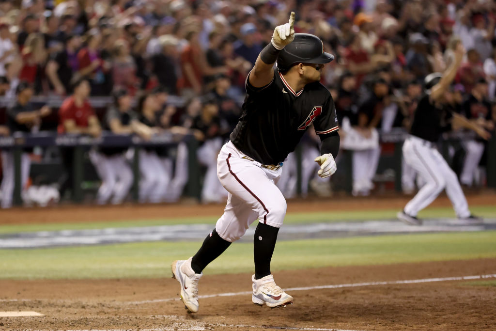 PHOENIX, ARIZONA - OCTOBER 20: Gabriel Moreno #14 of the Arizona Diamondbacks reacts after his RBI single against the Philadelphia Phillies in the eighth inning during Game Four of the National League Championship Series at Chase Field on October 20, 2023 in Phoenix, Arizona. 