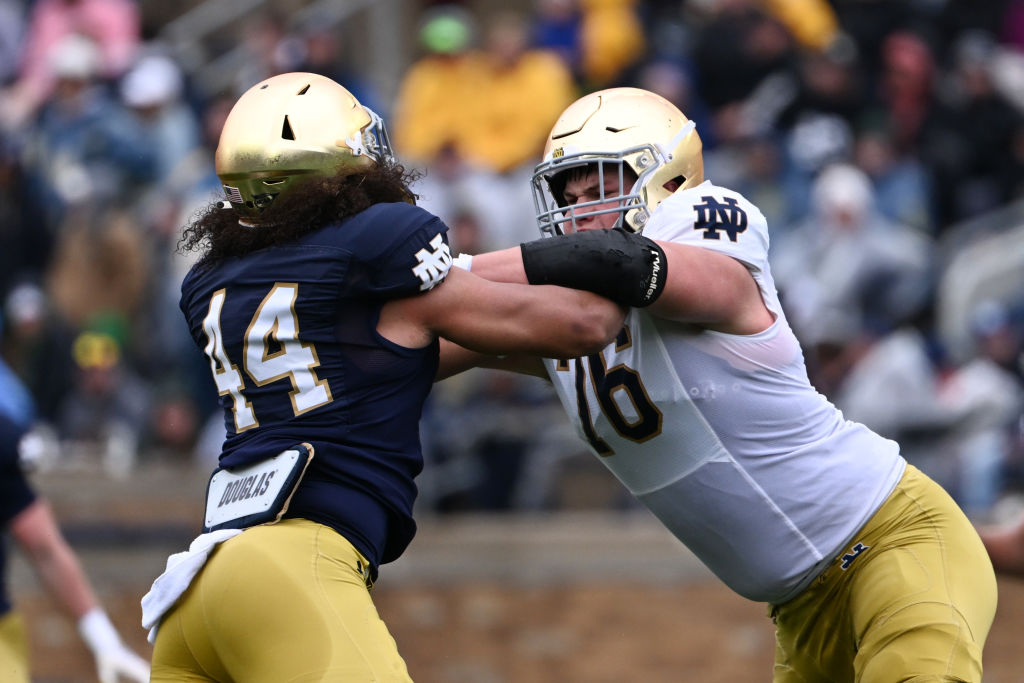 SOUTH BEND, INDIANA - APRIL 22: Joe Alt #76 and Junior Tuihalamaka #44 of the Notre Dame Fighting Irish battle during the Notre Dame Blue-Gold Spring Football Game at Notre Dame Stadium on April 22, 2023 in South Bend, Indiana. 