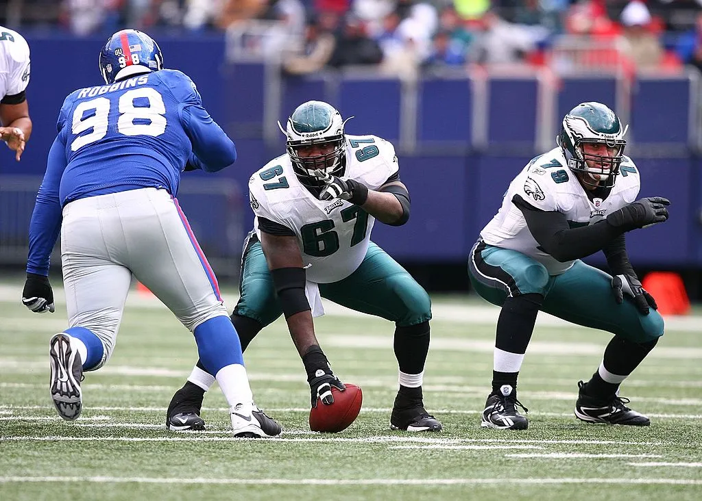 EAST RUTHERFORD, NJ - DECEMBER 07:  Jamaal Jackson #67, and Todd Herremans #79 of the Philadelphia Eagles get set to defend against Fred Robbins #98 of the New York Giants during their game on December 7, 2008 at Giants Stadium in East Rutherford, New Jersey. 