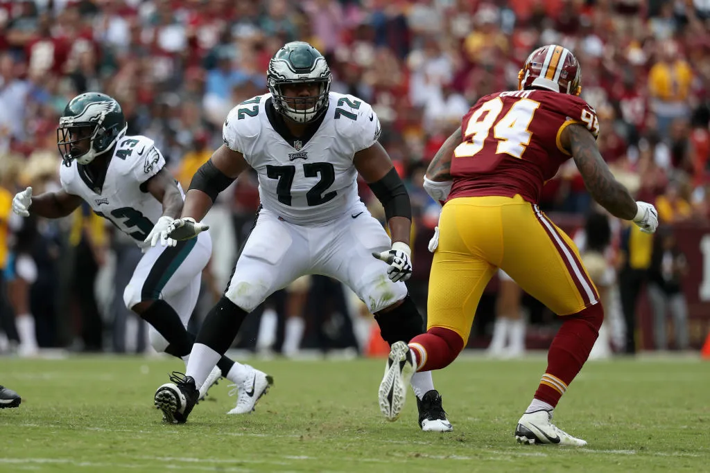 LANDOVER, MD - SEPTEMBER 10: Offensive tackle Halapoulivaati Vaitai #72 of the Philadelphia Eagles drops back to pass block on outside linebacker Preston Smith #94 of the Washington Redskins at FedExField on September 10, 2017 in Landover, Maryland. 