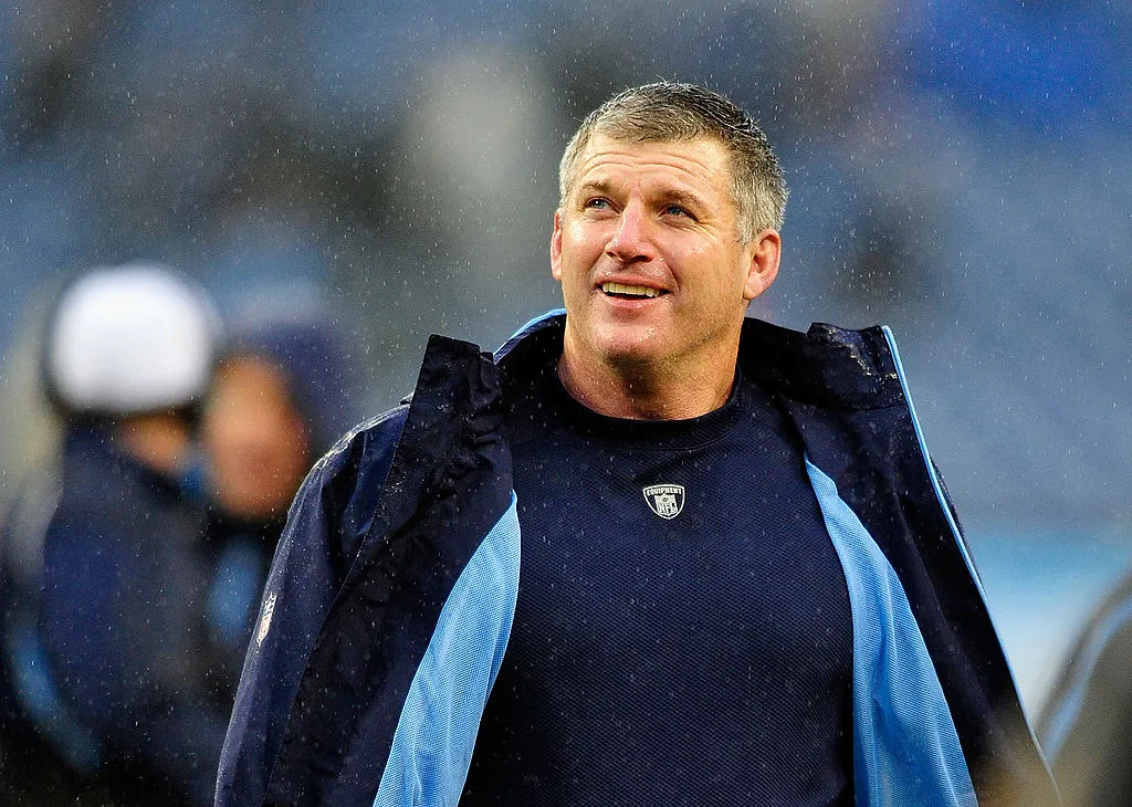 NASHVILLE, TN - NOVEMBER 27:  Coach Mike Munchak of the Tennessee Titans smiles as he leaves the field after a win over the Tampa Bay Buccaneers at LP Field on November 27, 2011 in Nashville, Tennessee. The Titans won 23-17. 