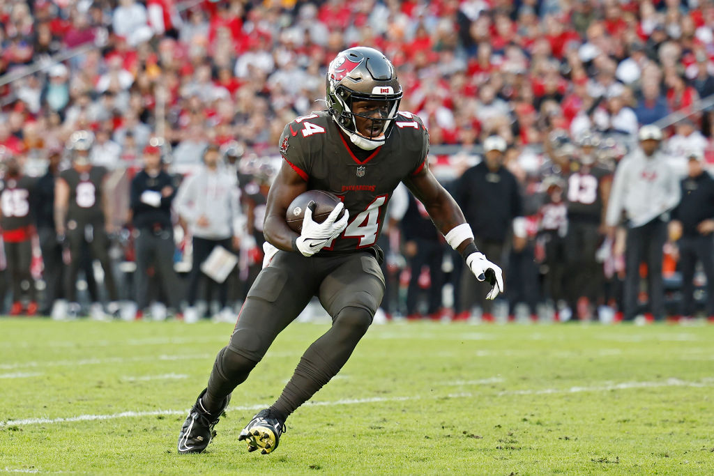 TAMPA, FLORIDA - DECEMBER 18: Chris Godwin #14 of the Tampa Bay Buccaneers runs the ball during the first quarter in the game against the Cincinnati Bengals at Raymond James Stadium on December 18, 2022 in Tampa, Florida. (