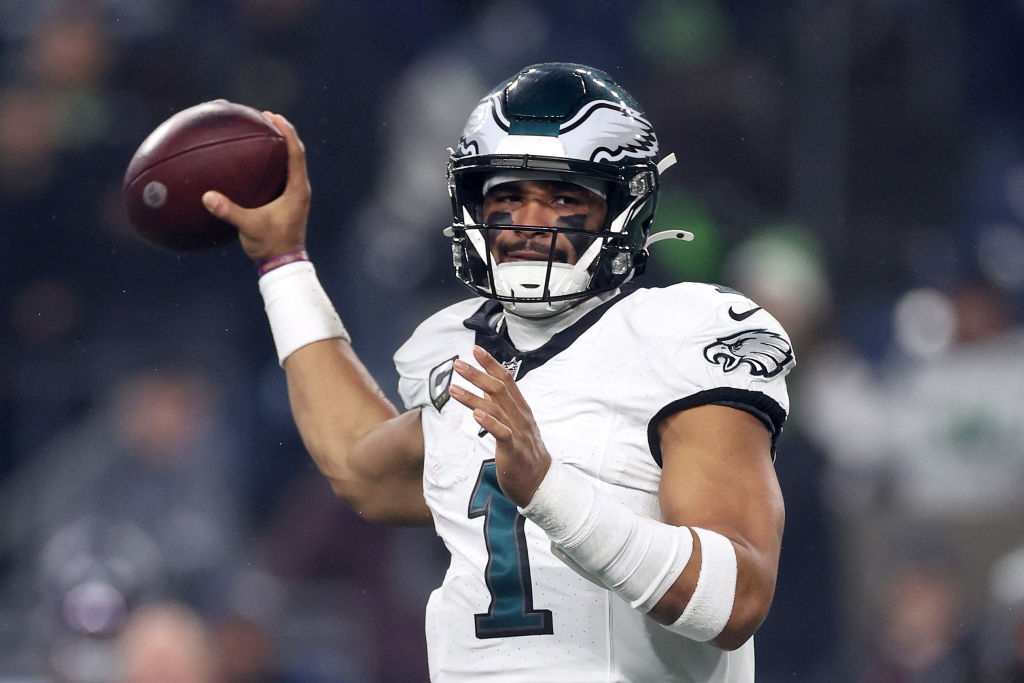 SEATTLE, WASHINGTON - DECEMBER 18: Jalen Hurts #1 of the Philadelphia Eagles passes during the first quarter against the Seattle Seahawks at Lumen Field on December 18, 2023 in Seattle, Washington.