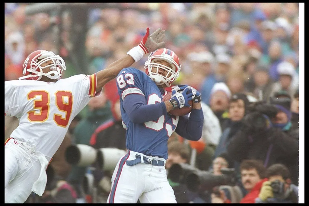 23 Jan 1994:  Wide receiver Andre Reed of the Buffalo Bills catches the ball as Kansas City Chiefs defensive back Bruce Pickens covers him during a playoff game at Rich Stadium in Orchard Park, New York.  The Bills won the game, 30-13. 