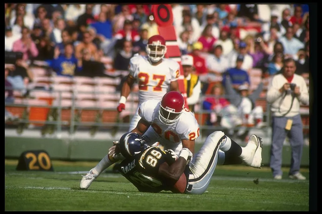 23 Dec 1990: Defensive back Deron Cherry of the Kansas City Chiefs tackles a San Diego Chargers player during a game at Jack Murphy Stadium in San Diego, California. The Chiefs won the game, 24-21.