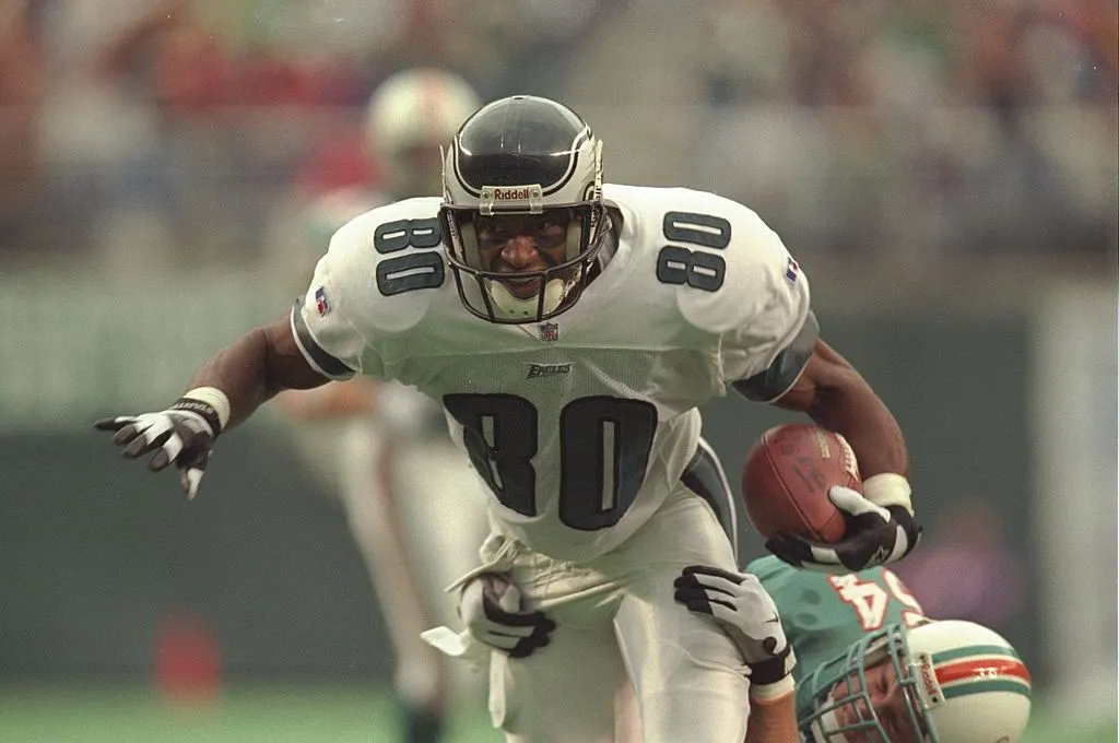 20 Oct 1996:  Wide receiver Irving Fryar #80 of the Philadelphia Eagles is wrapped up by linebacker Zach Thomas of the Miami Dolphins during the Eagles 35-28 win at Veterans Stadium in Philadelphia, Pennsylvania. 