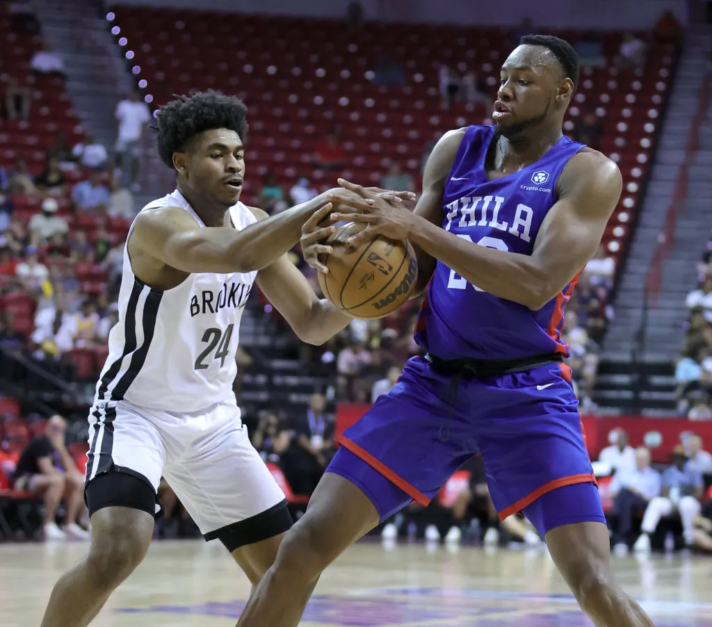 LAS VEGAS, NEVADA - JULY 10: Cam Thomas #24 of the Brooklyn Nets and Charles Bassey #23 of the Philadelphia 76ers vie for the ball during the 2022 NBA Summer League at the Thomas & Mack Center on July 10, 2022 in Las Vegas, Nevada.