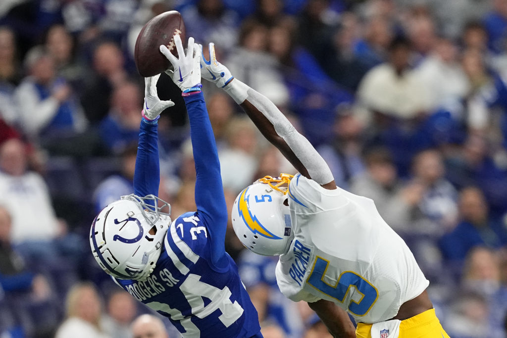 INDIANAPOLIS, INDIANA - DECEMBER 26: Isaiah Rodgers Sr. #34 of the Indianapolis Colts breaks up a pass intended for Joshua Palmer #5 of the Los Angeles Chargers at Lucas Oil Stadium on December 26, 2022 in Indianapolis, Indiana.