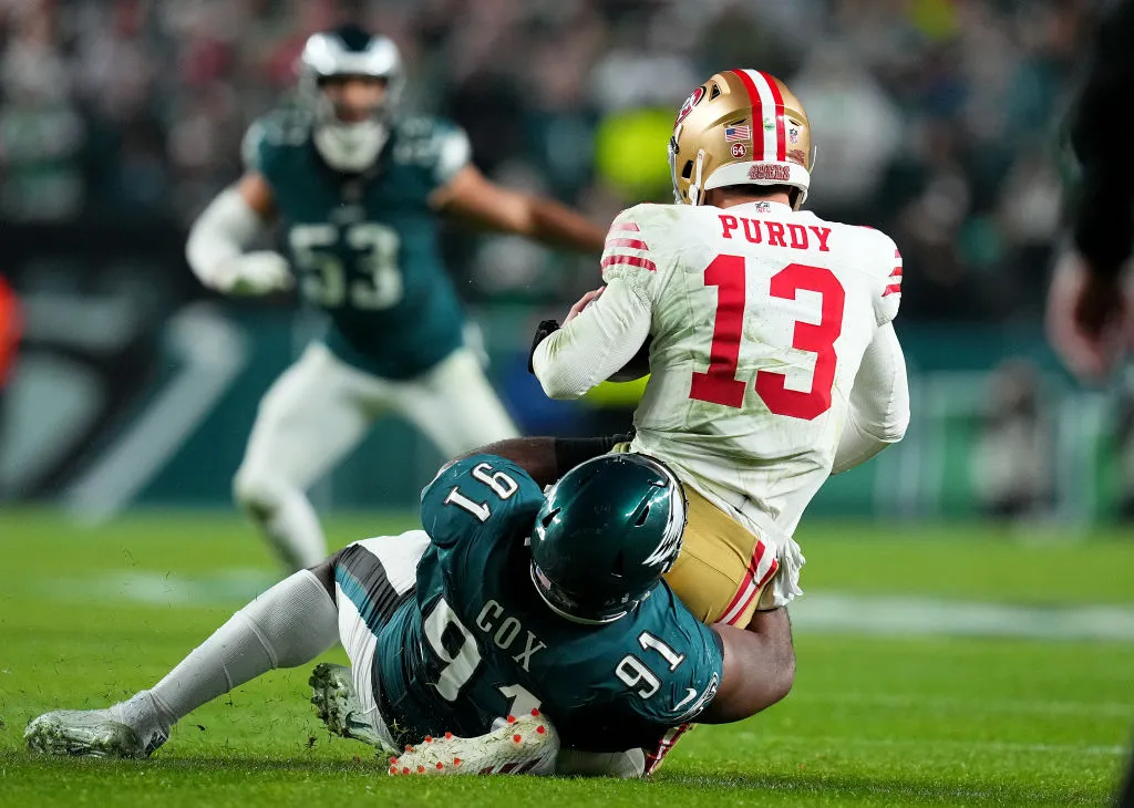 PHILADELPHIA, PENNSYLVANIA - DECEMBER 03: Brock Purdy #13 of the San Francisco 49ers is sacked by Fletcher Cox #91 of the Philadelphia Eagles in the third quarter at Lincoln Financial Field on December 03, 2023 in Philadelphia, Pennsylvania.