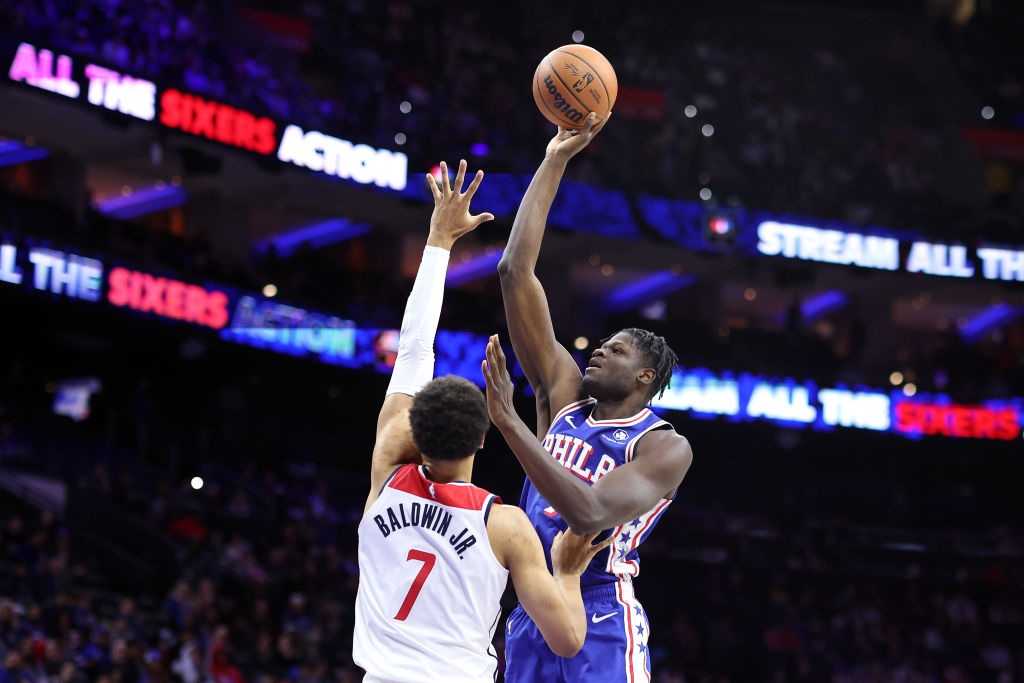 PHILADELPHIA, PENNSYLVANIA - DECEMBER 11: Mo Bamba #7 of the Philadelphia 76ers shoots over Patrick Baldwin Jr. #7 of the Washington Wizards during the fourth quarter at the Wells Fargo Center on December 11, 2023 in Philadelphia, Pennsylvania.