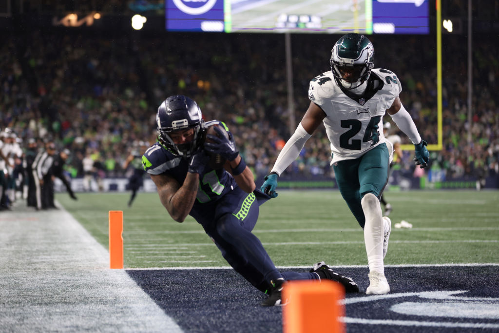 SEATTLE, WASHINGTON - DECEMBER 18: Jaxon Smith-Njigba #11 of the Seattle Seahawks catches a pass for a touchdown passed James Bradberry #24 of the Philadelphia Eagles in the fourth quarter at Lumen Field on December 18, 2023 in Seattle, Washington.