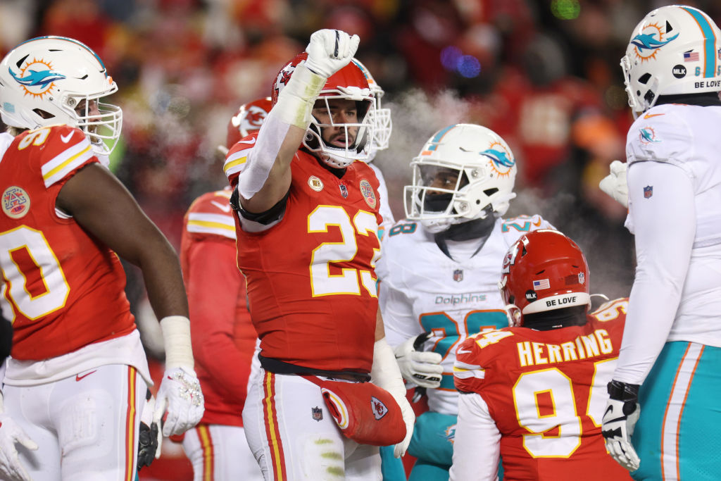 KANSAS CITY, MISSOURI - JANUARY 13: Drue Tranquill #23 of the Kansas City Chiefs signals after a defensive stop during the second half against the Miami Dolphins in the AFC Wild Card Playoffs at GEHA Field at Arrowhead Stadium on January 13, 2024 in Kansas City, Missouri.