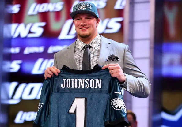 NEW YORK, NY - APRIL 25: Lane Johnson of the Oklahoma Sooners holds up a jersey on stage after he was picked #4 overall by the Philadelphia Eagles in the first round of the 2013 NFL Draft at Radio City Music Hall on April 25, 2013 in New York City. 
