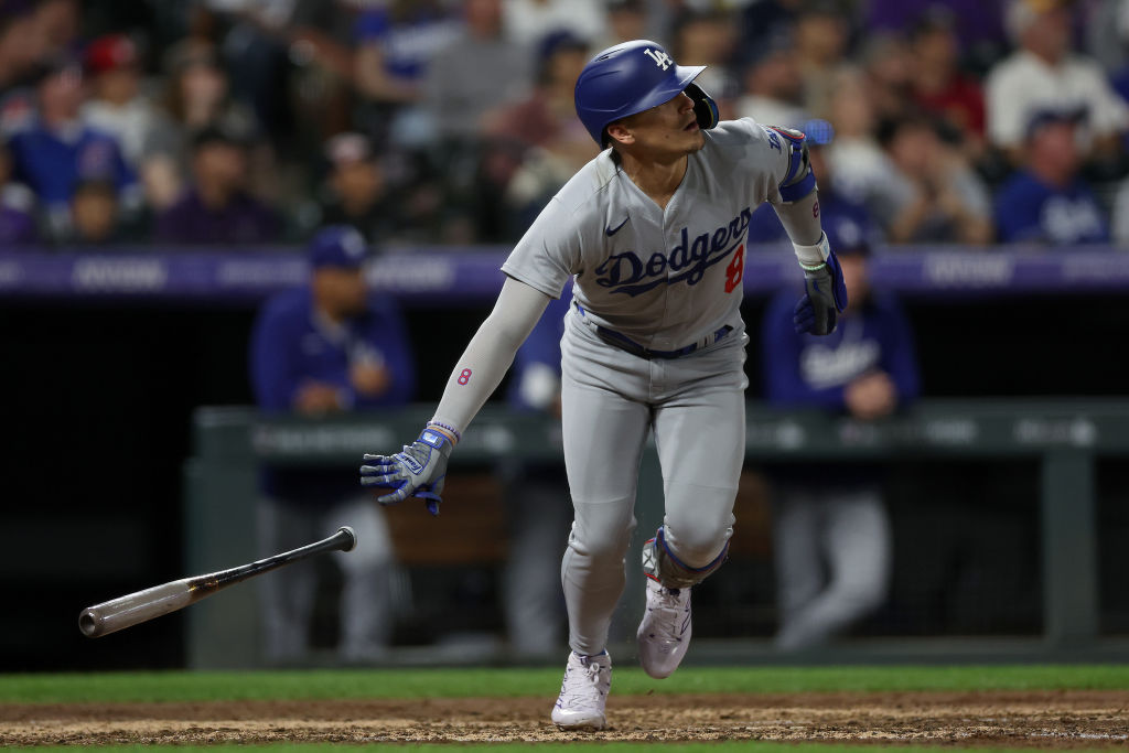DENVER, COLORADO - SEPTEMBER 26: Enrique Hernandez #8 of the Los Angeles Dodgers hits a RBI sacrifice fly against the Colorado Rockies in the fifth inning during Game Two of a Doubleheader at Coors Field on September 26, 2023 in Denver, Colorado.