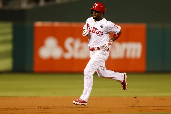 PHILADELPHIA, PA - AUGUST 27: Jimmy Rollins #11 of the Philadelphia Phillies rounds the bases after hitting a solo home run in the first inning of the game against the Washington Nationals at Citizens Bank Park on August 27, 2014 in Philadelphia, Pennsylvania.