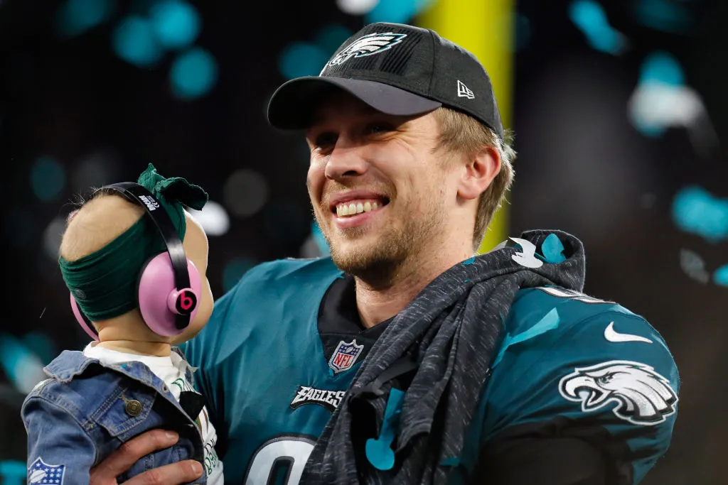 MINNEAPOLIS, MN - FEBRUARY 04: Nick Foles #9 of the Philadelphia Eagles celebrates with his daughter Lily Foles after his 41-33 victory over the New England Patriots in Super Bowl LII at U.S. Bank Stadium on February 4, 2018 in Minneapolis, Minnesota. The Philadelphia Eagles defeated the New England Patriots 41-33.