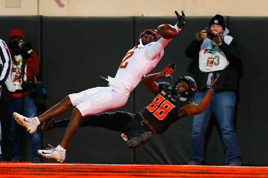 Defensive back T.J. Tampa #2 of the Iowa State Cyclones blocks a touchdown pass as wide receiver Langston Anderson #88 of the Oklahoma State Cowboys gets tangled up in the fourth quarter of the game at Boone Pickens Stadium 