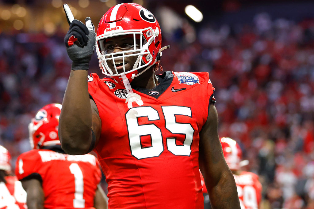 Amarius Mims #65 of the Georgia Bulldogs reacts after a touchdown during the second quarter against the Ohio State Buckeyes in the Chick-fil-A Peach Bowl at Mercedes-Benz Stadium on December 31, 2022 in Atlanta, Georgia. 