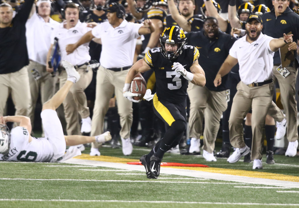 Defensive back Cooper DeJean #3 of the Iowa Hawkeyes runs a punt return down the sideline during the second half against the Michigan State Spartans at Kinnick Stadium