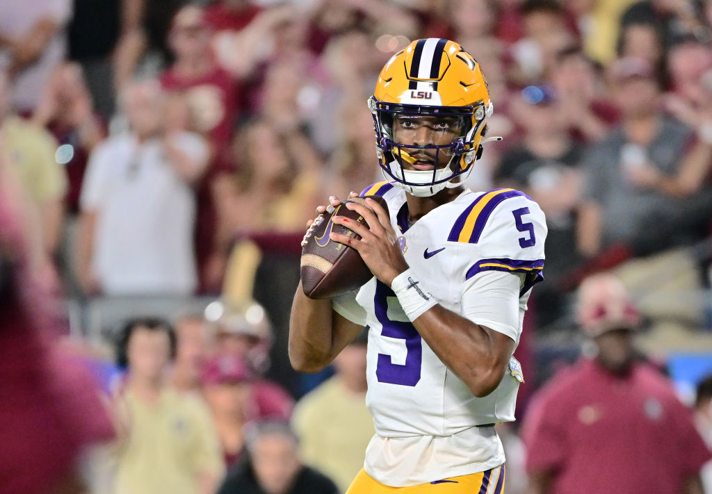  Jayden Daniels #5 of the LSU Tigers looks to throw a pass in the first half of a game against the Florida State Seminoles at Camping World Stadium 