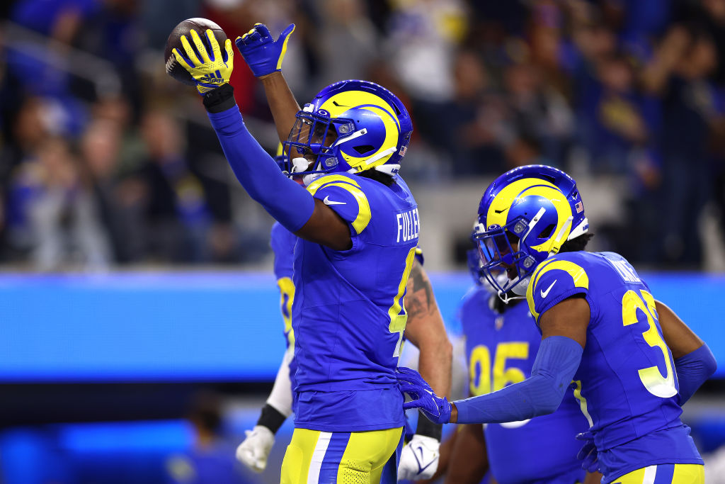 Jordan Fuller #4 of the Los Angeles Rams celebrates with his teammates after intercepting a pass thrown by Derek Carr #4 of the New Orleans Saints during the third quarter of the game at SoFi Stadium on December 21, 2023 in Inglewood, California. 