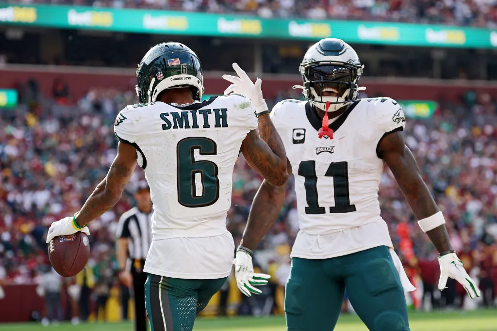 LANDOVER, MARYLAND - OCTOBER 29: DeVonta Smith #6 celebrates a fourth quarter touchdown with A.J. Brown #11 of the Philadelphia Eagles during a game against the Washington Commanders at FedExField on October 29, 2023 in Landover, Maryland.