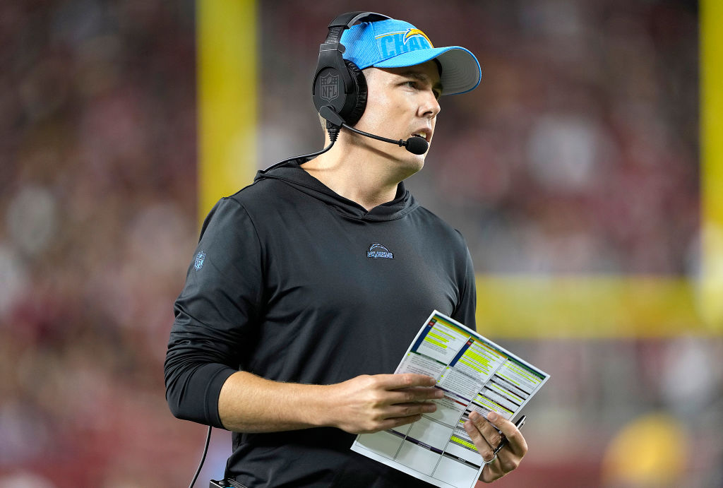 SANTA CLARA, CALIFORNIA - AUGUST 25: Offensive coordinator Kellen Moore of the Los Angeles Chargers looks on from the sidelines against the San Francisco 49ers during the third quarter of a preseason game at Levi's Stadium on August 25, 2023 in Santa Clara, California.