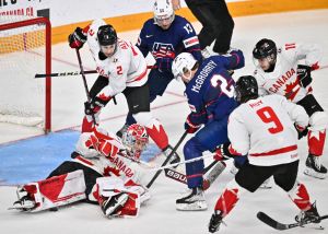 Goaltender Thomas Milic #1 of Team Canada makes a pad save on a tip by Rutger Mcgroarty #2 of Team United States during the third period in the semifinal round of the 2023 IIHF World Junior Championship at Scotiabank Centre on January 4, 2023 in Halifax, Nova Scotia, Canada. 