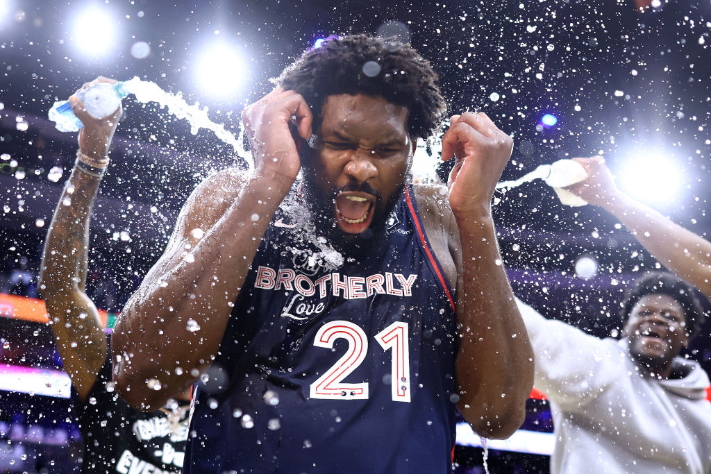 PHILADELPHIA, PENNSYLVANIA - JANUARY 22: Joel Embiid #21 of the Philadelphia 76ers reacts after being showered with water after defeating the San Antonio Spurs at the Wells Fargo Center on January 22, 2024 in Philadelphia, Pennsylvania. Embiid scored a franchise-record 70 points in the game. NOTE TO USER: User expressly acknowledges and agrees that, by downloading and or using this photograph, User is consenting to the terms and conditions of the Getty Images