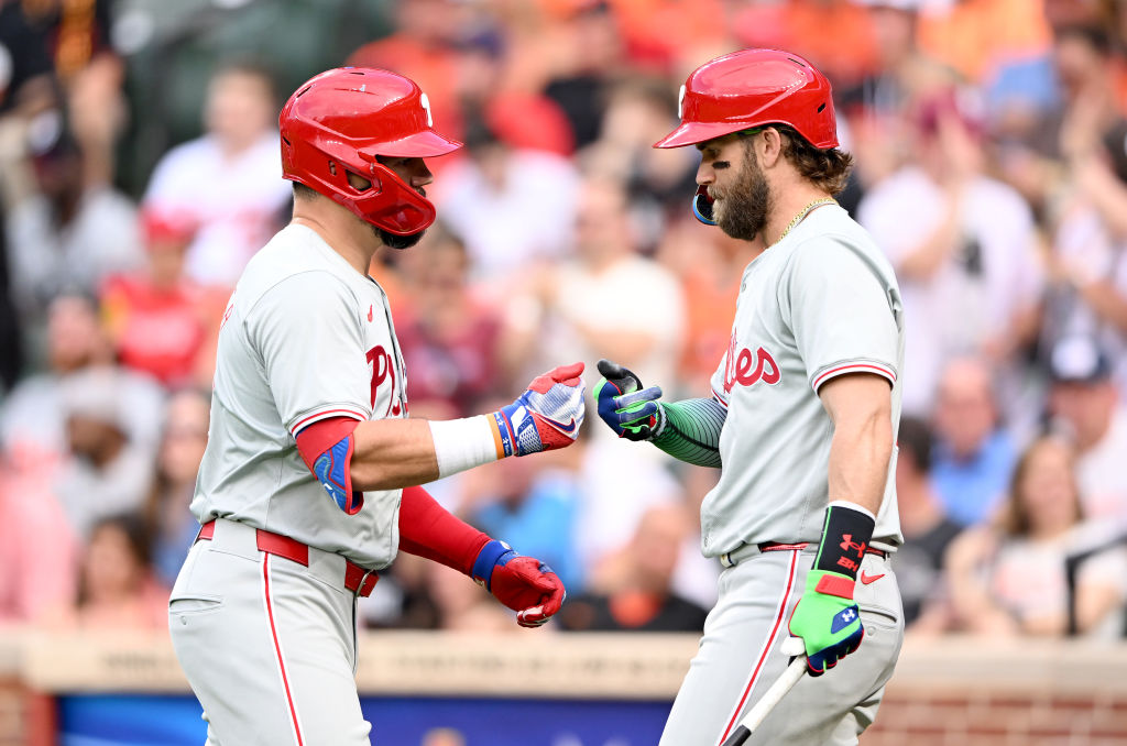 BALTIMORE, MARYLAND - JUNE 14: Kyle Schwarber #12 of the Philadelphia Phillies (L) celebrates with Bryce Harper #3 after hitting a home run in the first inning against the Baltimore Orioles at Oriole Park at Camden Yards on June 14, 2024 in Baltimore, Maryland. 