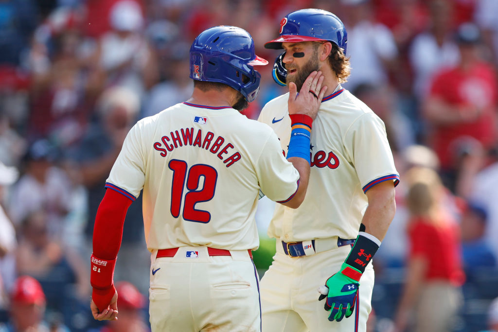 PHILADELPHIA, PENNSYLVANIA - JUNE 22: Bryce Harper #3 of the Philadelphia Phillies gets a pat on the cheek by Kyle Schwarber #12 after he hit a two-run home run against the Arizona Diamondbacks during the third inning of a game at Citizens Bank Park on June 22, 2024 in Philadelphia, Pennsylvania. 