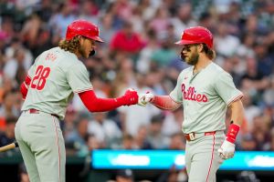 Alec Bohm #28 and Bryce Harper #3 of the Philadelphia Phillies celebrate Harper's home run against the Detroit Tigers during the top of the ninth inning at Comerica Park on June 25, 2024 in Detroit, Michigan.