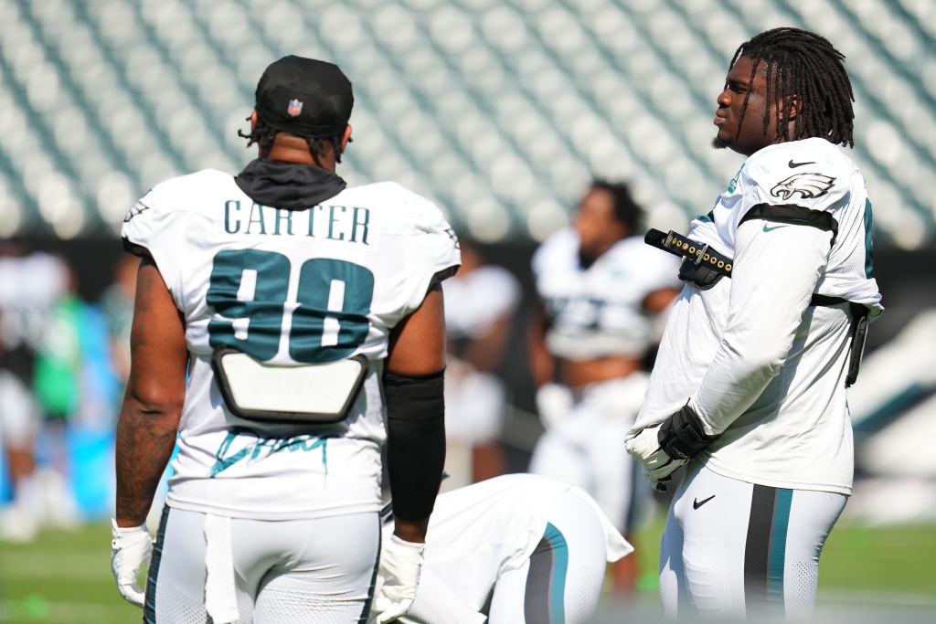 PHILADELPHIA, PENNSYLVANIA - AUGUST 9: Jalen Carter #98 of the Philadelphia Eagles talks to Jordan Davis #90 during Training Camp at Lincoln Financial Field on August 9, 2023 in Philadelphia, Pennsylvania.