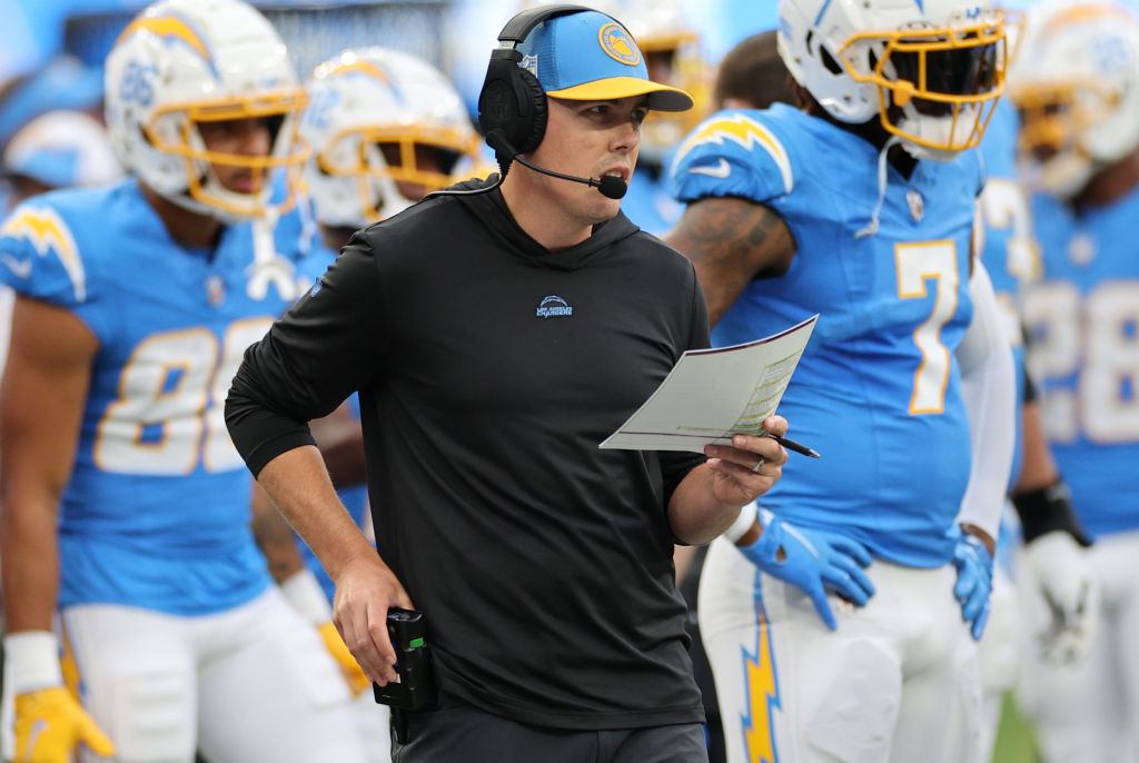 INGLEWOOD, CALIFORNIA - OCTOBER 01: Offensive coordinator Kellen Moore of the Los Angeles Chargers looks on against the Las Vegas Raiders during the first half at SoFi Stadium on October 01, 2023 in Inglewood, California.