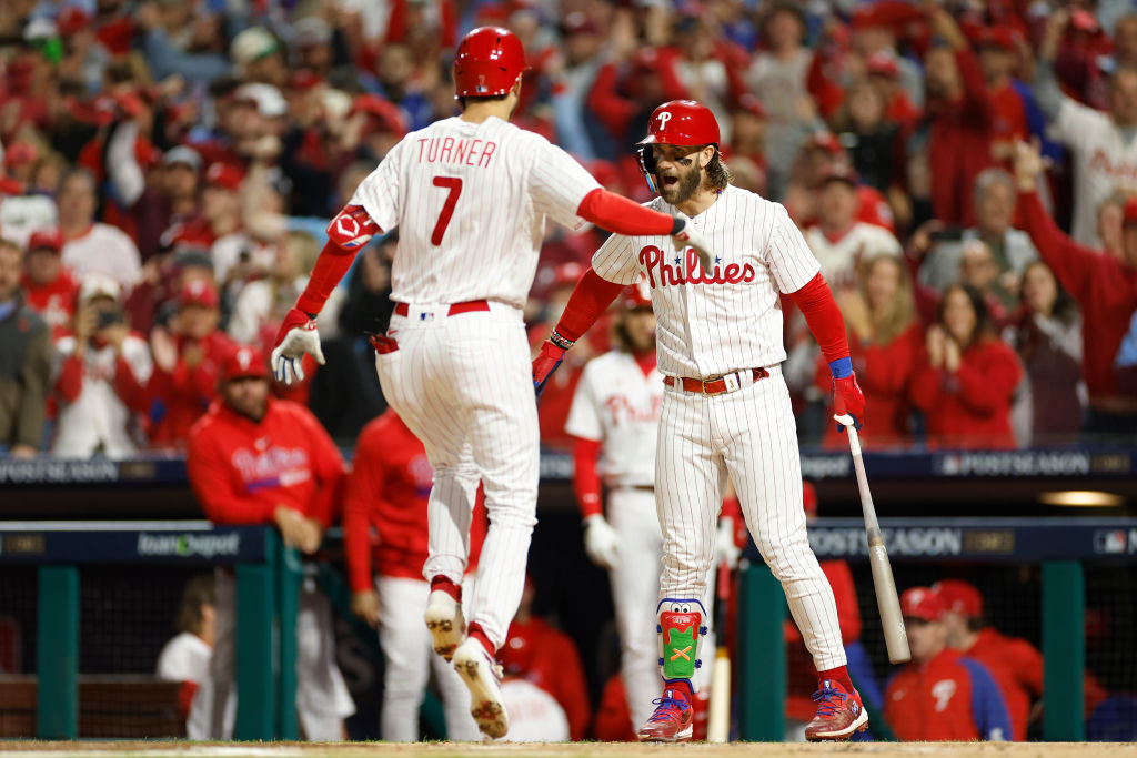 PHILADELPHIA, PENNSYLVANIA - OCTOBER 17: Trea Turner #7 of the Philadelphia Phillies celebrates with Bryce Harper #3 after his first inning solo home run against the Arizona Diamondbacks during Game Two of the Championship Series at Citizens Bank Park on October 17, 2023 in Philadelphia, Pennsylvania.